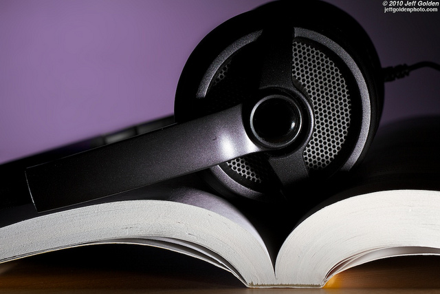 Image of a book with a big earphone