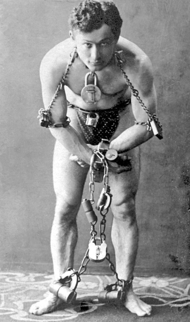 Full-length portrait of Houdini, in chains