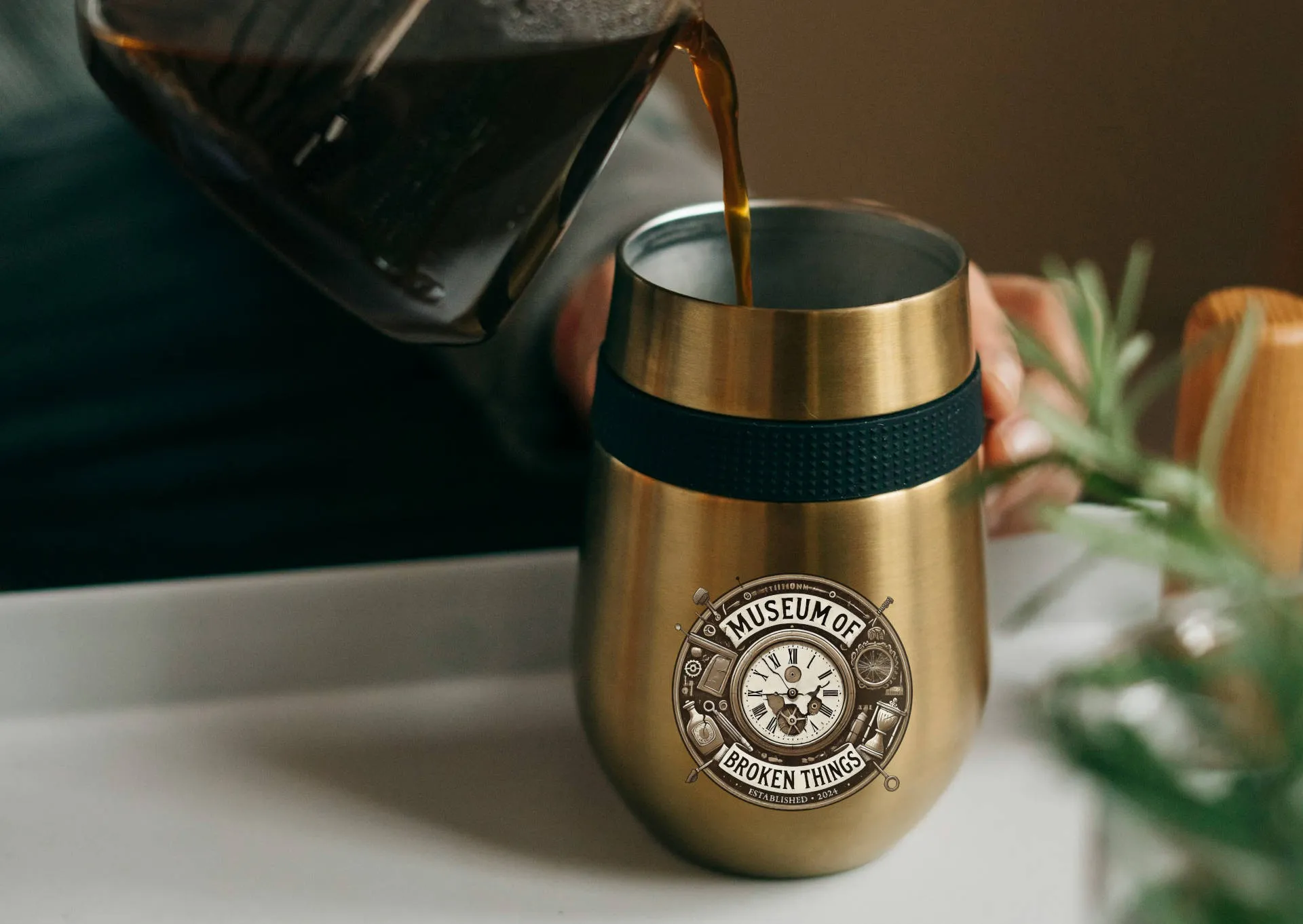 Stainless steel travel mug with the Museum logo on the side