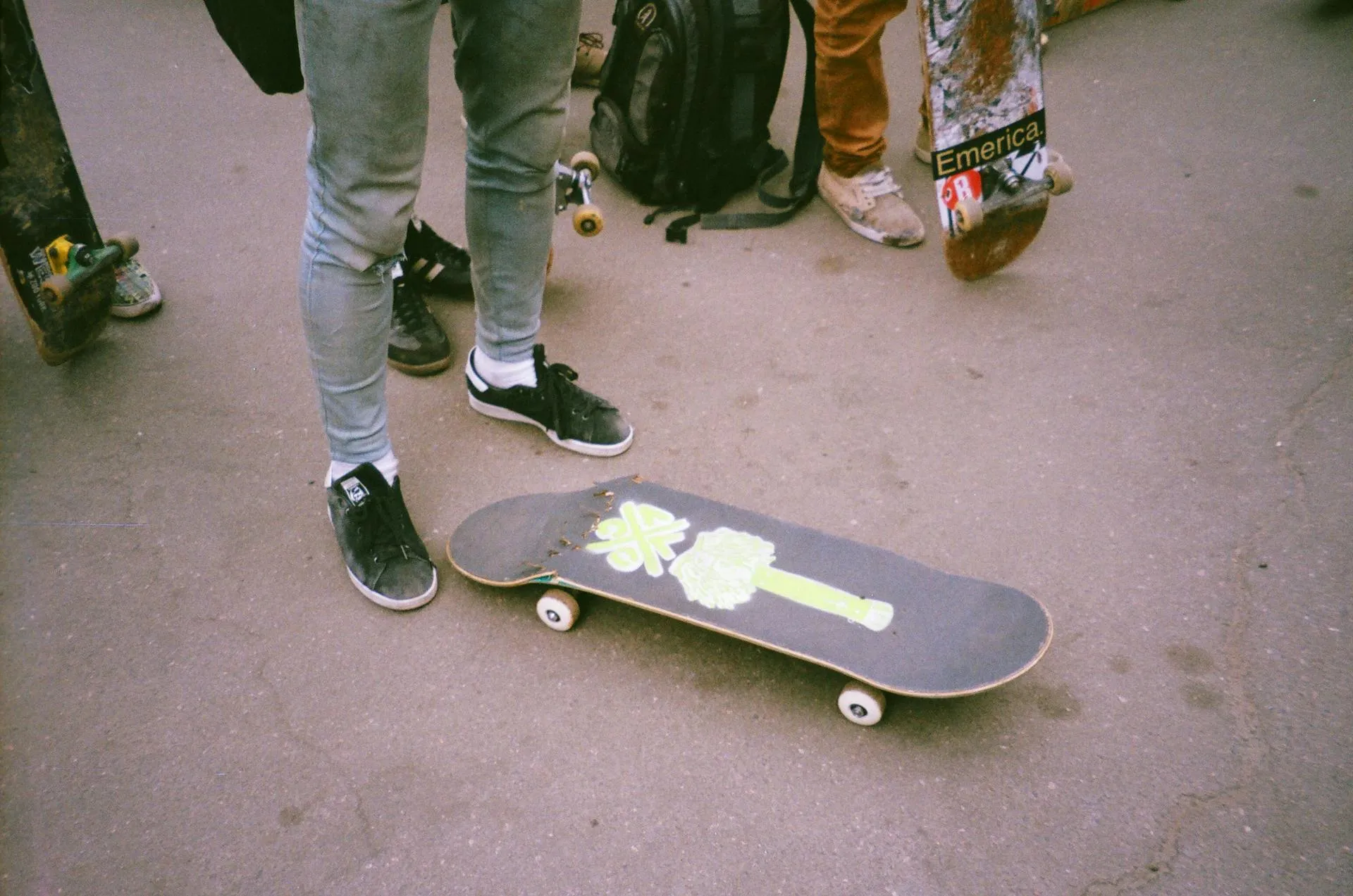 A skateboard which has split near one pair of wheels.